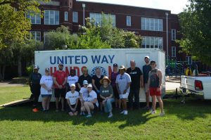 Group of people pose in front of United Way Hands On tool trailer
